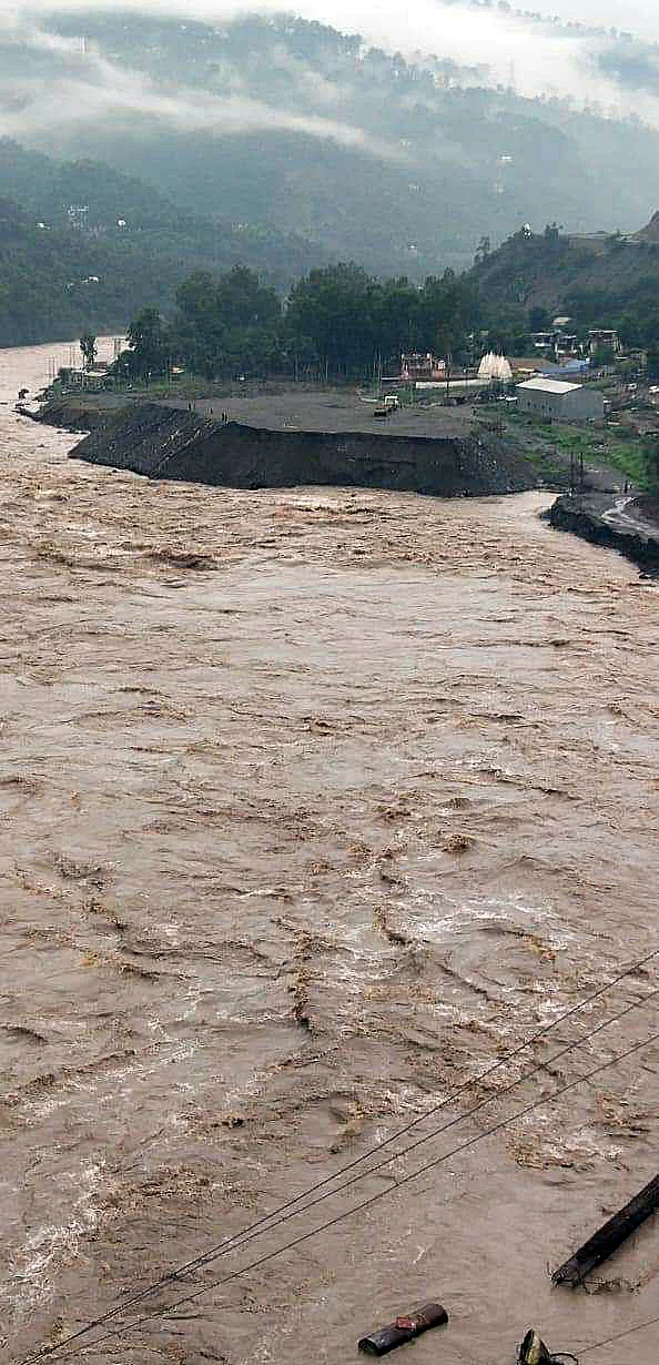 The water level of the Chenab river rises due to the heavy rainfall, in Kishtwar, Jammu and Kashmir on Wednesday.