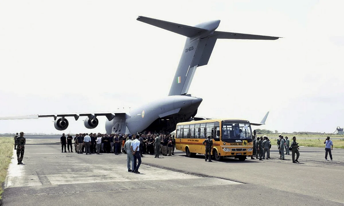 Indian nationals on their arrival from crisis-hit Afghanistan by an Indian Air Forces C-17 aircraft, in Jamnagar, Tuesday, August 17, 2021.
