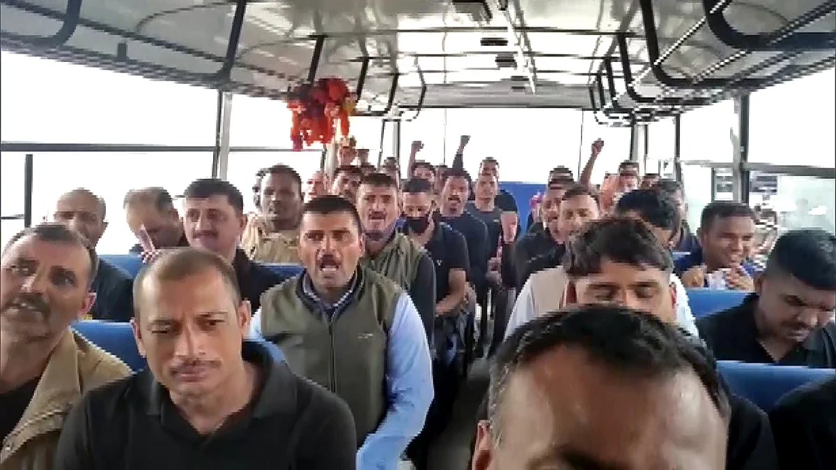 Evacuated Indians from Kabul chant Bharat Mata ki Jai inside a bus after landing at Jamnagar on Tuesday.