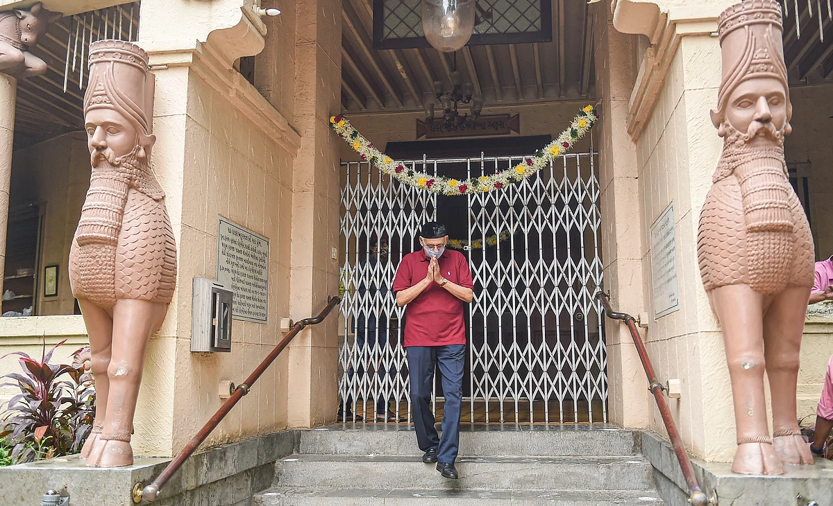 A Parsi man comes out of the Fire Temple during Parsi New Year, in Mumbai, Monday, Aug. 16, 2021.