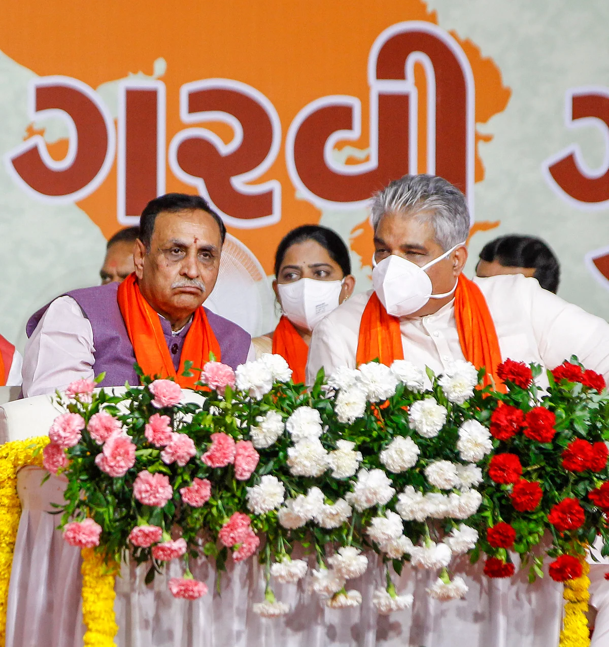 Union Minister and Gujarat BJP in-charge Bhupendra Yadav with former state chief minister Vijay Rupani during swearing-in ceremony of the State Cabinet Ministers, at Raj bhavan in Gandhinagar, Thursday, September 16, 2021.
