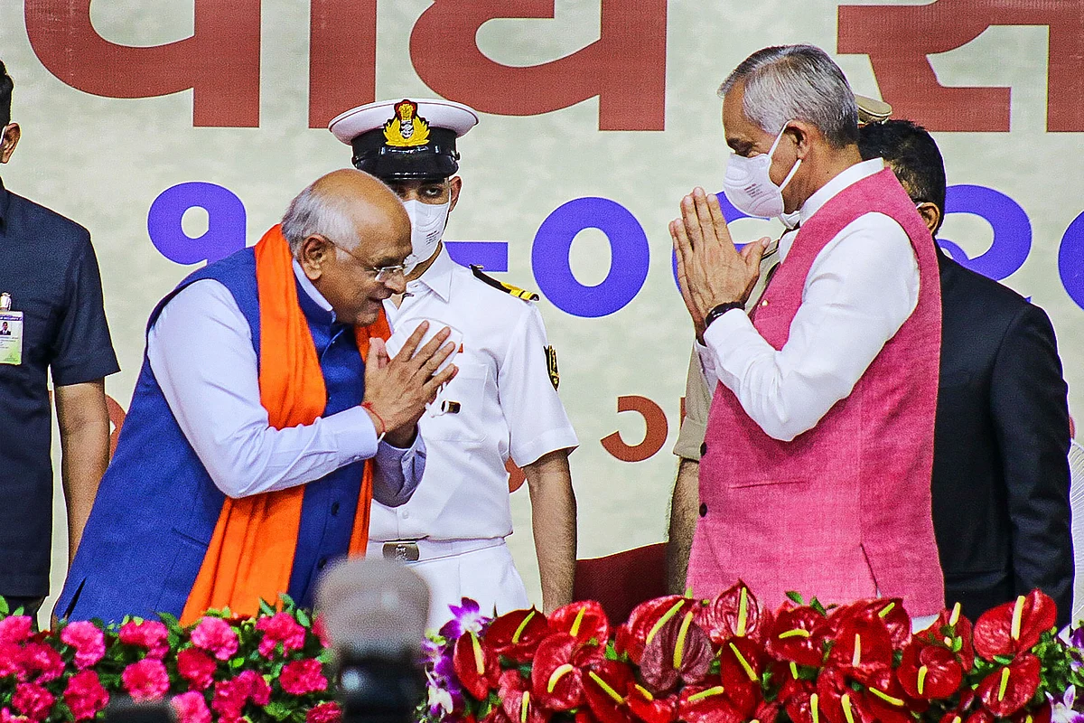 Gujarat Chief Minister Bhupendra Patel greets Gujarat Governor Acharya Devvrat during the state ministerial Cabinet swearing-in ceremony in Gandhinagar, Thursday, Sept. 16, 2021.