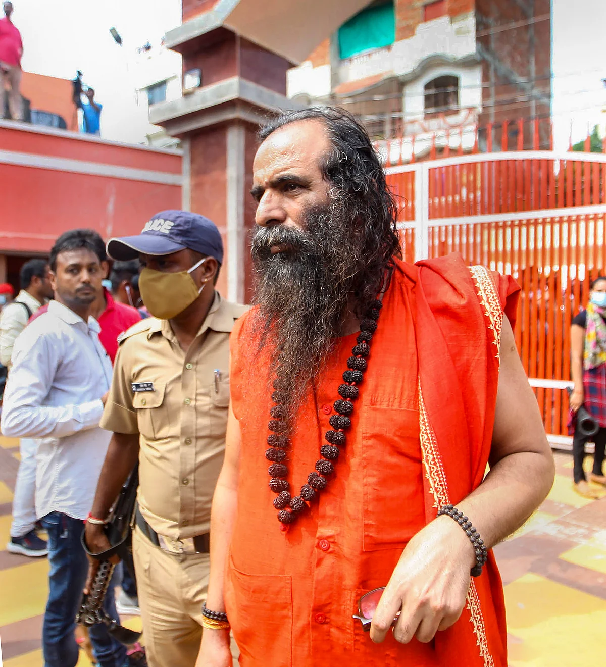 Niranjani Akhada secretary Mahant Ravindra Puri arrives at Baghambari Math, where Akhara Parishad President Mahant Narendra Giri Maharaj was found dead yesterday, in Prayagraj, Tuesday, Sept. 21, 2021.