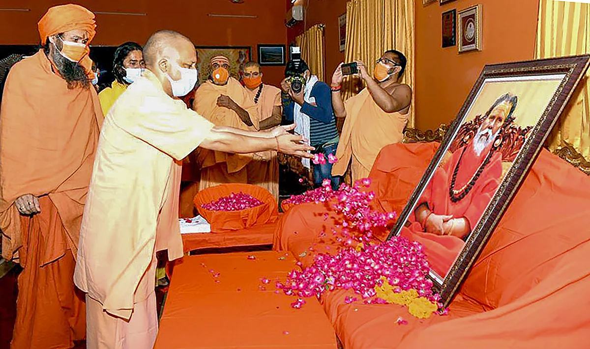UP CM Yogi Adityanath pays tribute to Akhil Bharatiya Akhara Parishad President Mahant Narendra Giri Maharaj, who was found dead at the Baghambari Gaddi Math in mysterious conditions, in Prayagraj, Tuesday, Sept. 21, 2021.