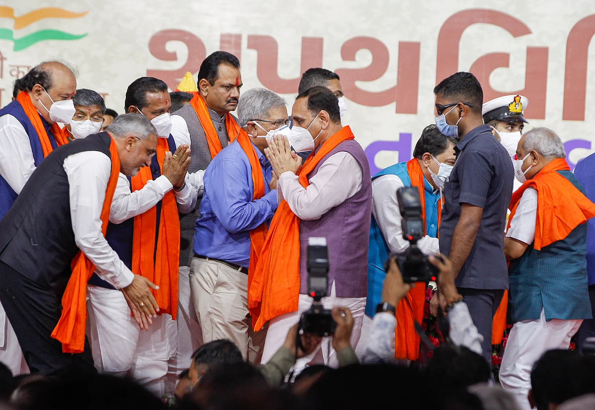 Newly sworn-in state ministers and former Gujarat CM Vijay Rupani after the the state ministerial Cabinet swearing-in ceremony in Gandhinagar, Thursday, Sept. 16, 2021.