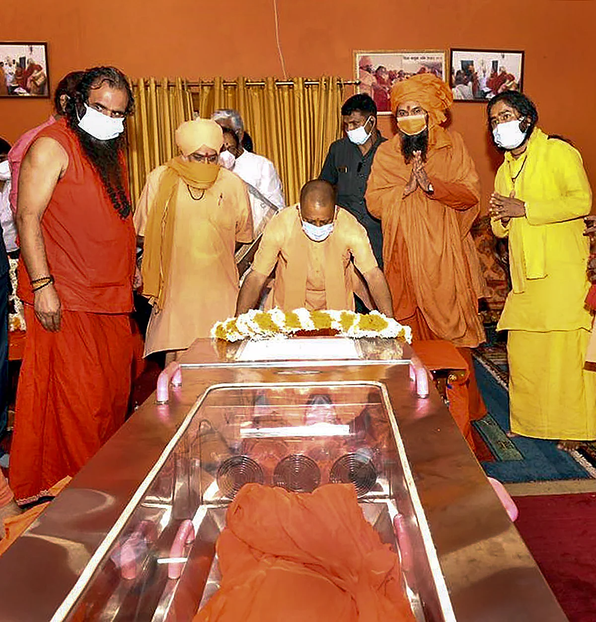UP CM Yogi Adityanath pays tribute to Akhil Bharatiya Akhara Parishad President Mahant Narendra Giri Maharaj, who was found dead at the Baghambari Gaddi Math in mysterious conditions, in Prayagraj, Tuesday, Sept. 21, 2021.