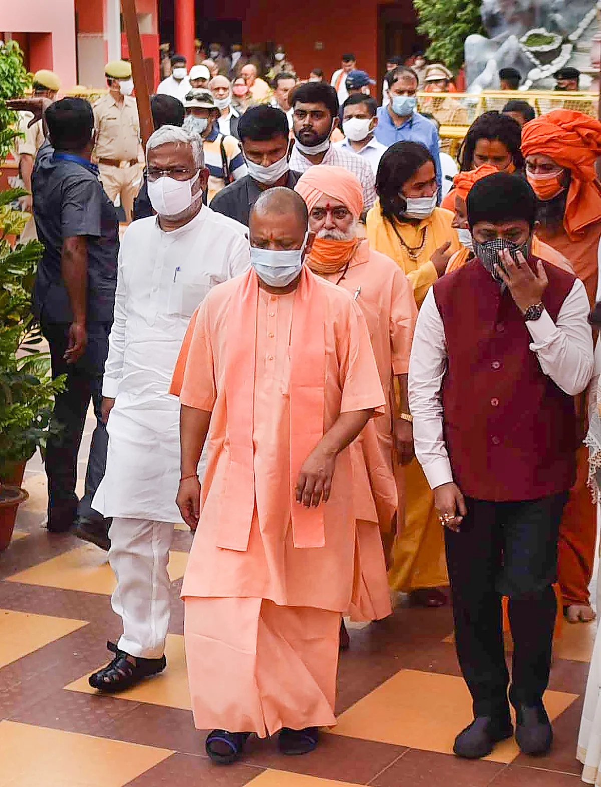 UP CM Yogi Adityanath arrives to pay tribute to Akhil Bharatiya Akhara Parishad President Mahant Narendra Giri Maharaj, who was found dead at the Baghambari Gaddi Math in mysterious conditions, in Prayagraj, Tuesday, Sept. 21, 2021.