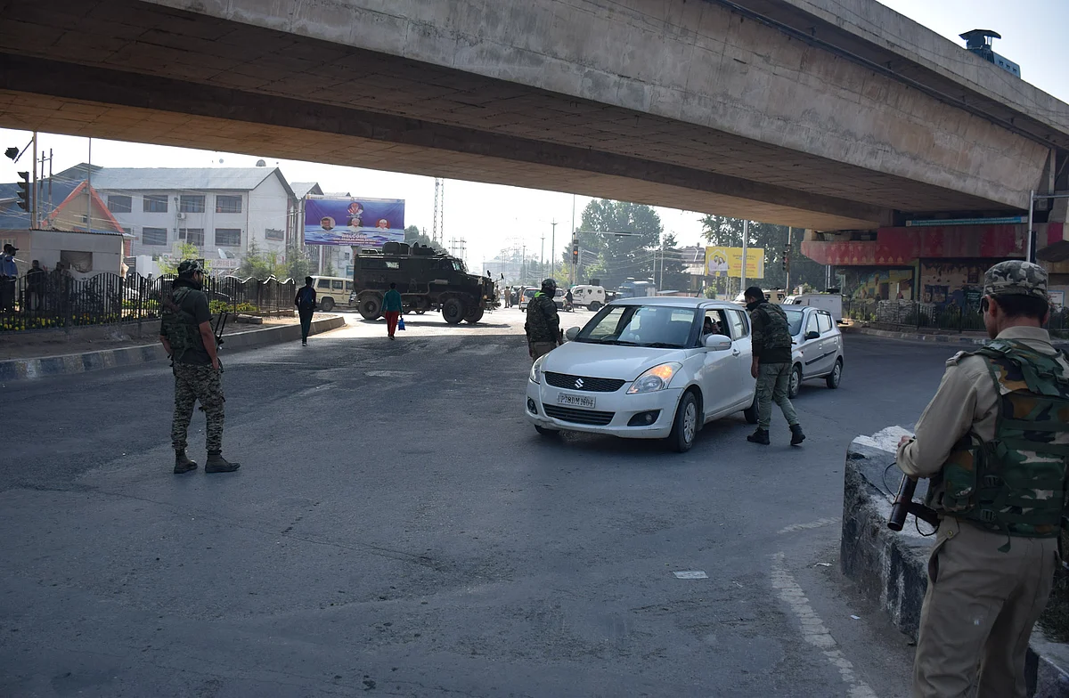 Police guard a checkpoint during restrictions in Srinagar, Jammu & Kashmir on September 2, 2021.