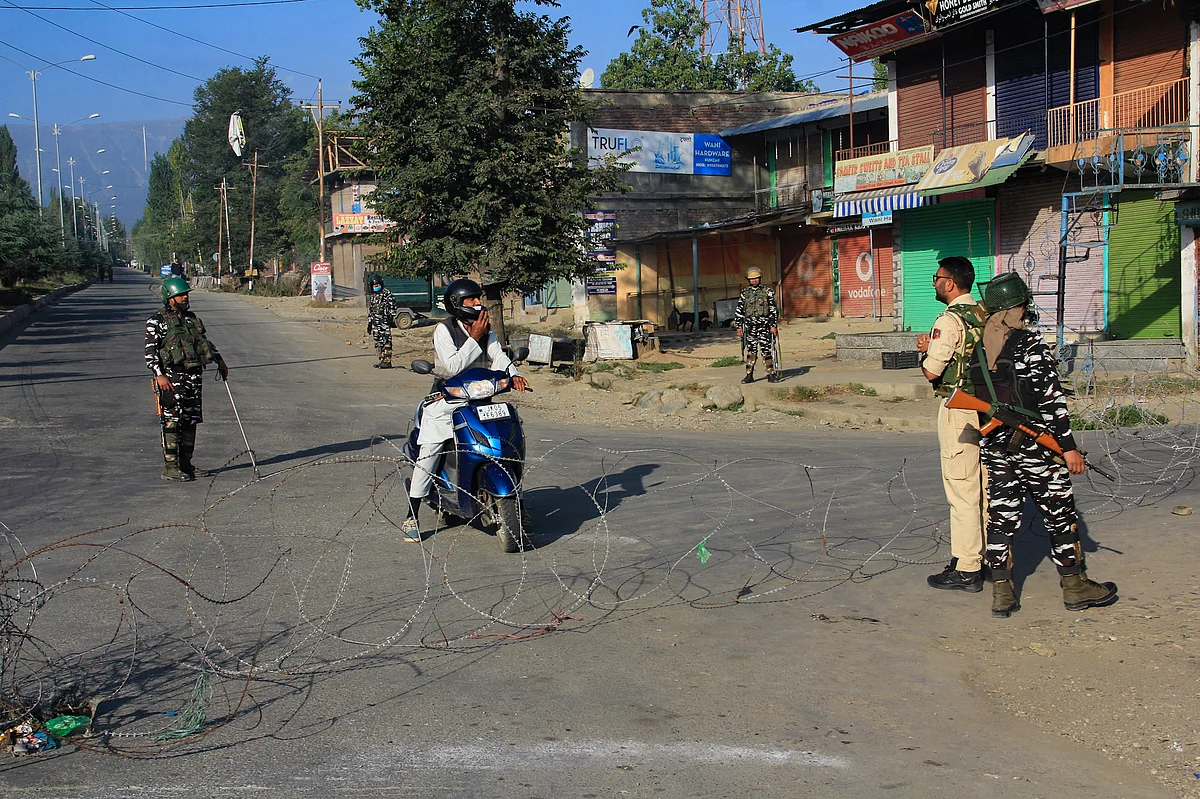 Police question a motorist at a checkpoint during restrictions in Srinagar, Jammu & Kashmir on September 2, 2021.