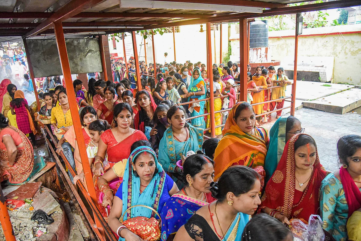 Patna: People wait in queues at a temple to offer prayers on the occasion of Maha Navami during the Navratri festival, in Patna, Thursday, Oct. 14, 2021.