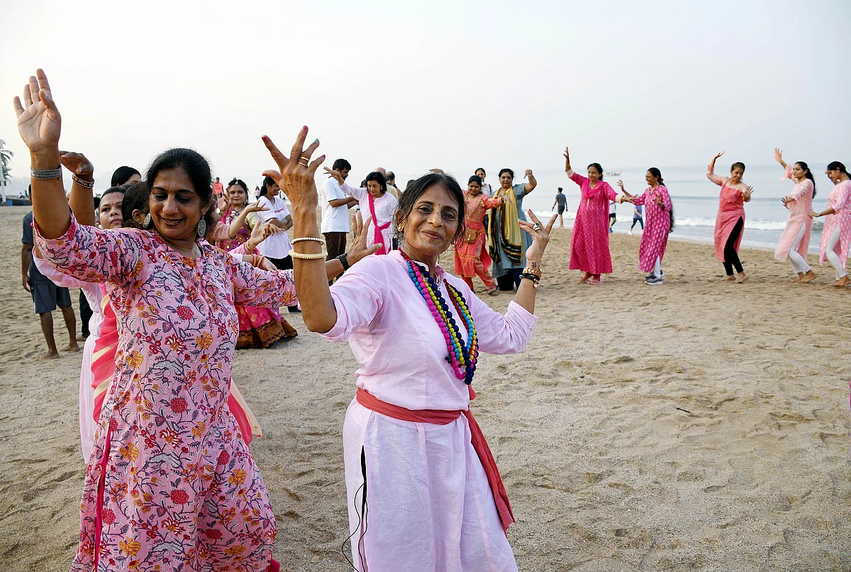 Women perform Garba at Juhu beach on Navmi of Navratri festival, in Mumbai on Thursday.