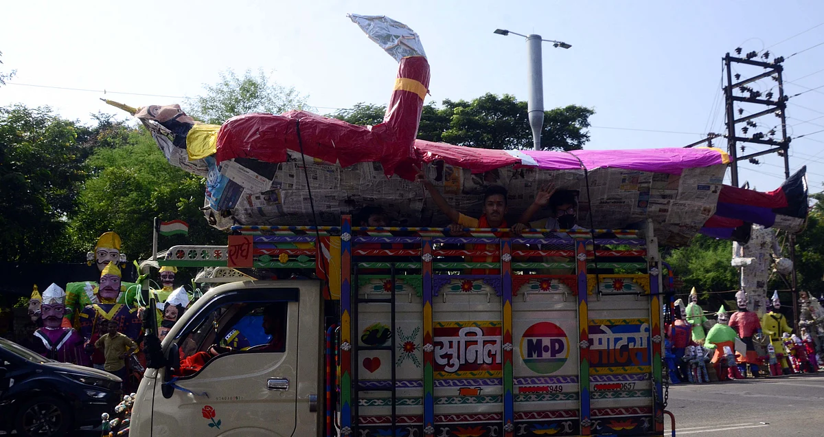 An effigy of Ravana being carried on a loading auto on the eve of Dussehra festival in Bhopal on Thursday.