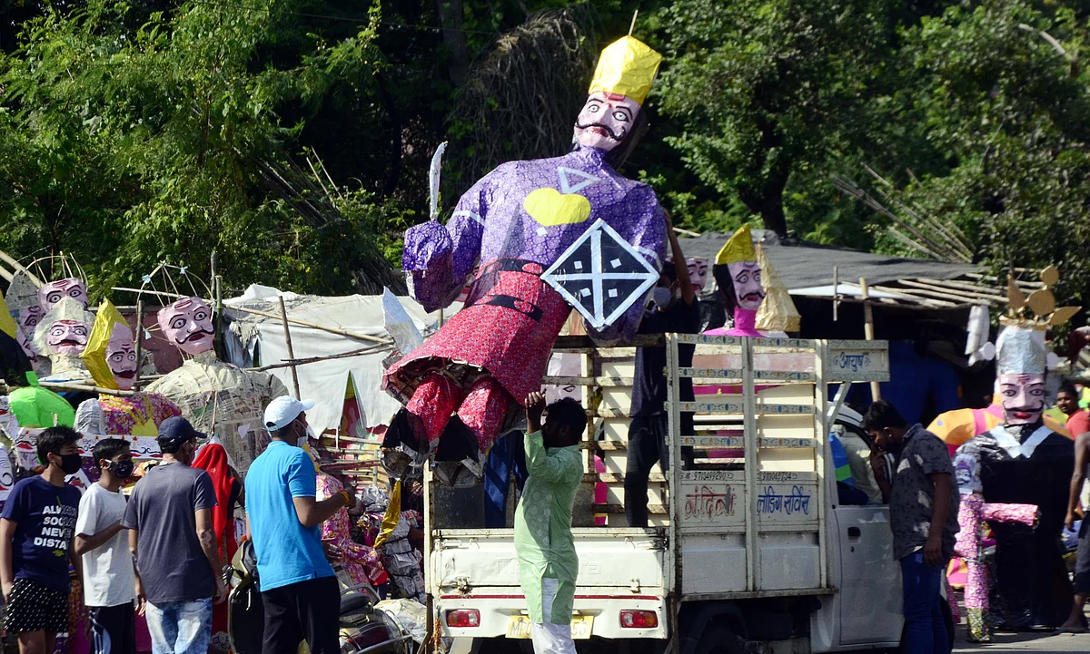 An effigy of Ravana being carried on a loading auto on the eve of Dussehra festival in Bhopal on Thursday