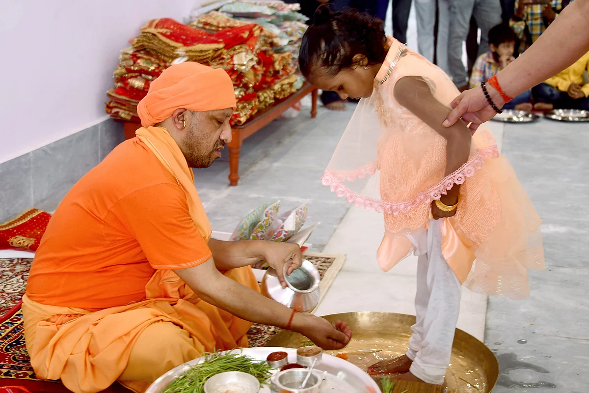 Uttar Pradesh Chief Minister Yogi Adityanath performs Kanya Pujan ritual on Navmi of Navratri festival, in Gorakhpur on Thursday.