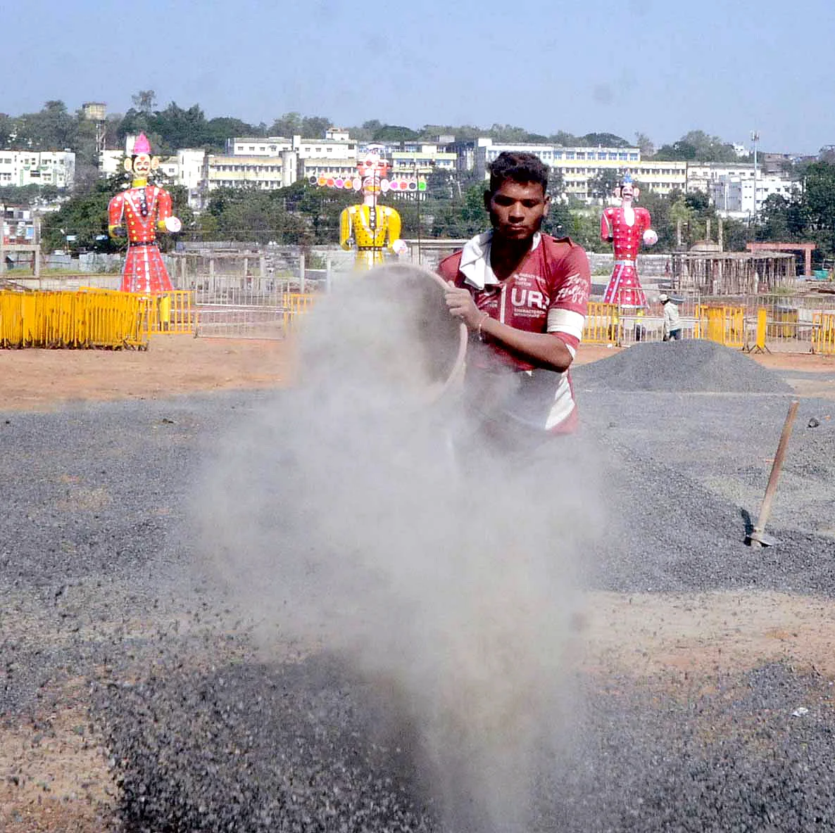 A worker prepares a ground on the eve of the Dussehra festival, in Bhopal on Thursday.