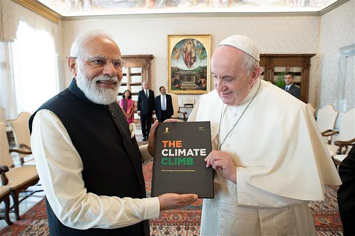 PM Modi gifts specially-made silver candelabra and a book on India's climate initiatives to Pope...