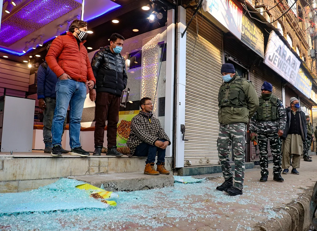 Soldiers stand after a grenade attack by suspected militants in Srinagar.