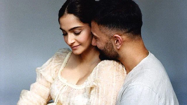 Pics: Pregnant Sonam Kapoor cradles her baby bump in husband Anand Ahuja's arms in latest photoshoot