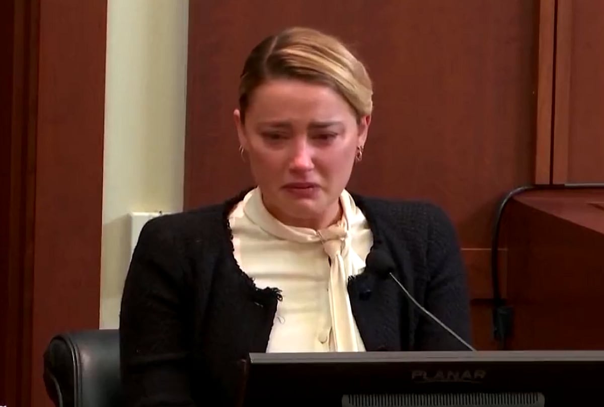 Amber Heard says Johnny Depp sexually assaulted her with a liquor