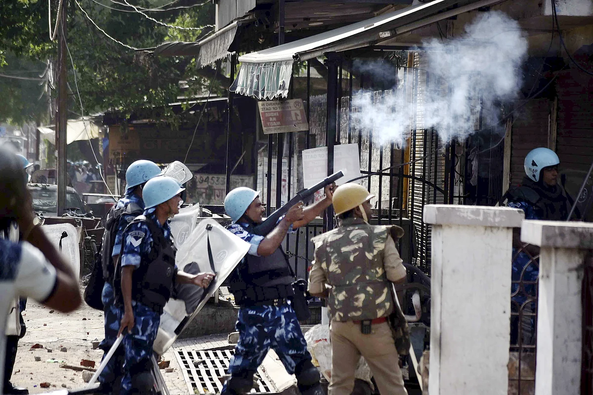 Prayagraj: Police personnel fire tear gas to disperse agitators during a protest over the controversial remarks by two now-suspended BJP leaders against Prophet Mohammad, after the Friday prayers, in Prayagraj, Friday, June 10, 2022.