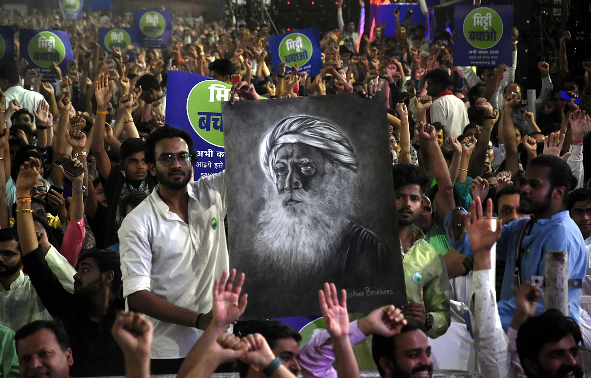 A man holds sketch of Sadhguru Yogi Vasudev Jaggi at 'Mitti sanrakshan Jan-Jagran' programme in Bhopal on Thursday