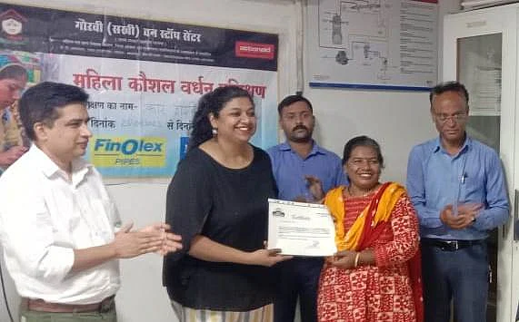 A certificate being handed over to Pranita Sontakke who underwent driving training at Gauravi