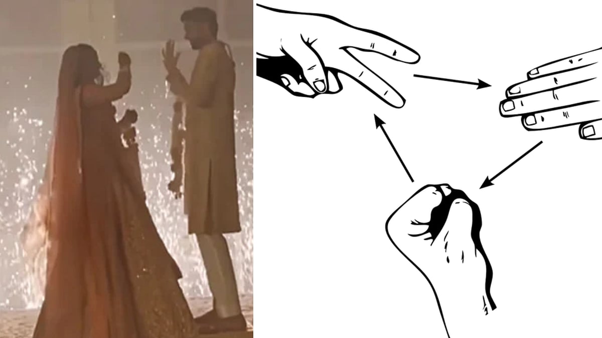 Watch: Bride and groom play 'stone paper scissors' during varmala ritual; netizens say 'aww, how sweet' - Vimarsana News