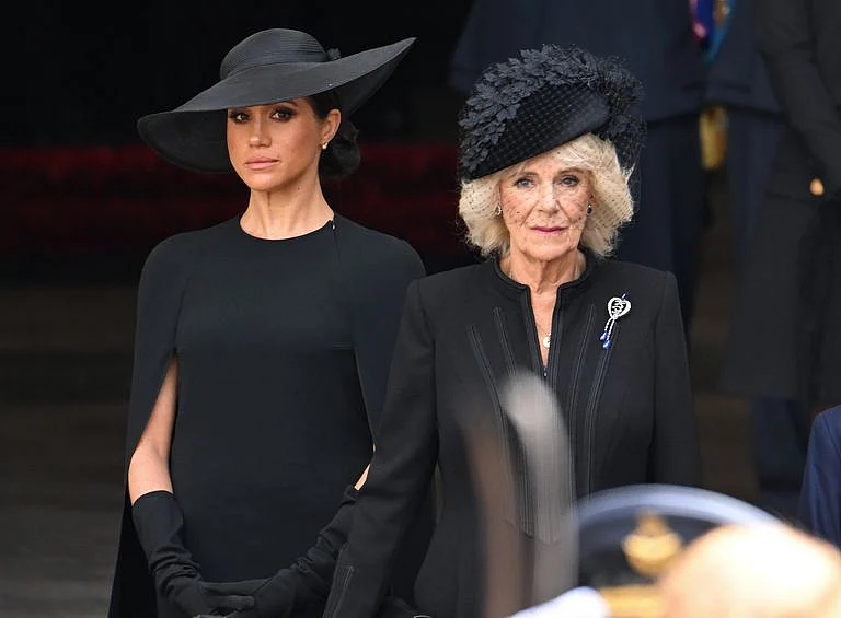 Camila Parker Bowles wearing her Hesse Diamond Jubilee Brooch,
with Meghan Markl.