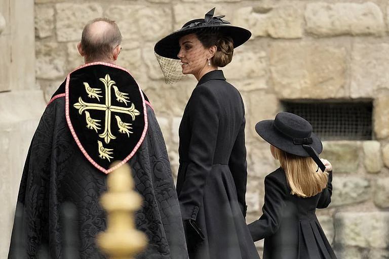 Kate Middleton wore Queen Elizabeth's pearls and a black Alexander McQueen coat dress to the funeral.