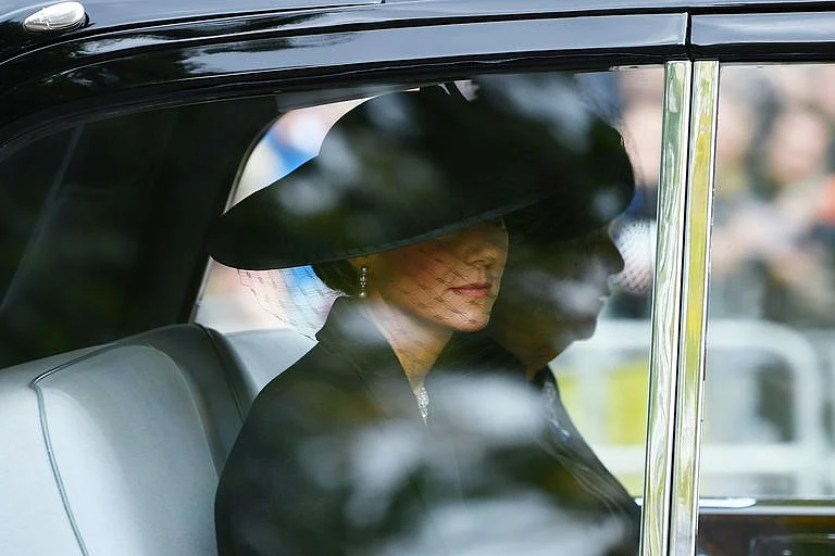 Kate Middleton wore a black-netted veil.