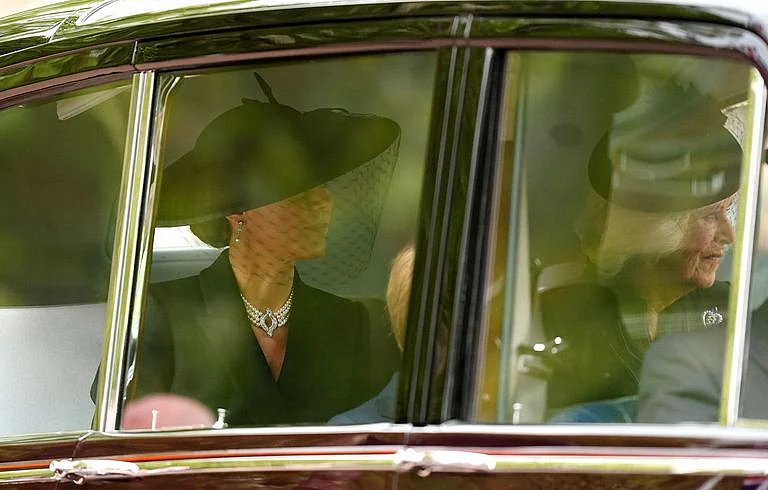 Kate Middleton wore the Queen's four-row pearl choker.