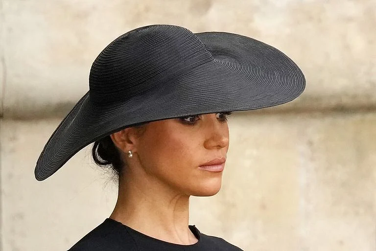 Meghan Markle wore a pair of pearl and diamond drop earrings, gifted to her by the Queen.