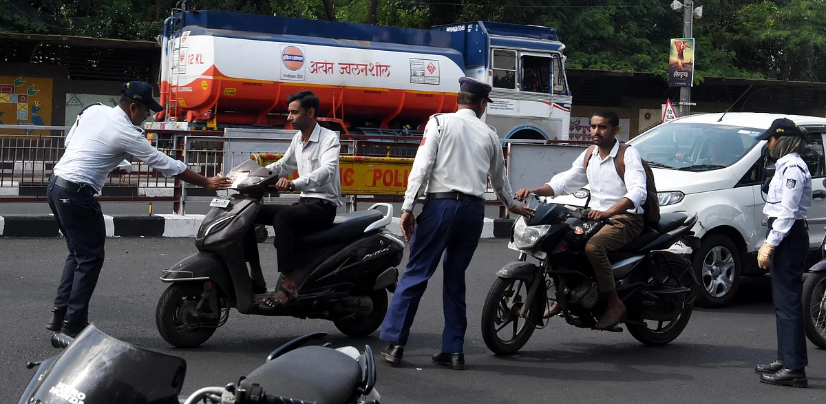 Cops checking traffic rule violators in city on Monday