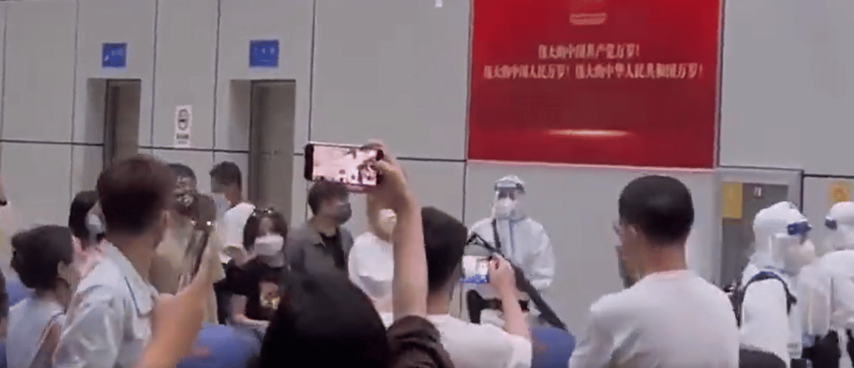Chinas enforced Zero Covid policy leads to chaos at airport as crowd confronts armed guards