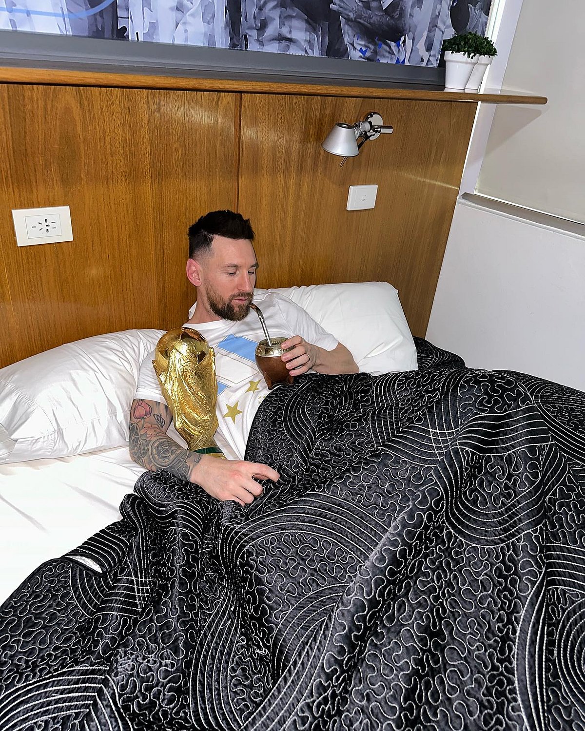 lionel-messi-sleeps-and-drinks-with-fifa-world-cup-trophy-in-viral-post