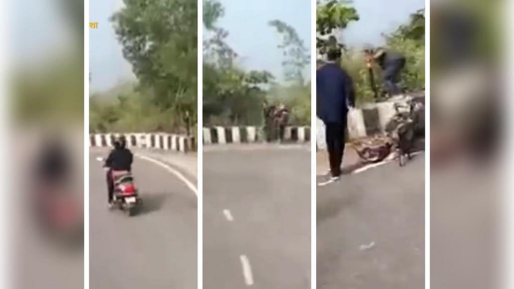 ON CAMERA: Woman rider rams two-wheeler on boundary wall of deep trench; escapes death by inches - Vimarsana News