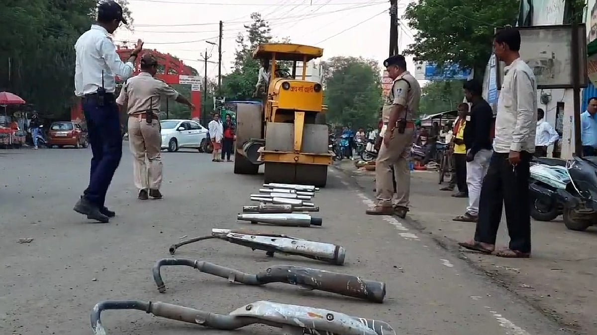 WATCH: MP's Mandla district traffic police crushes modified bike silencers with road roller, issues challans - Vimarsana News