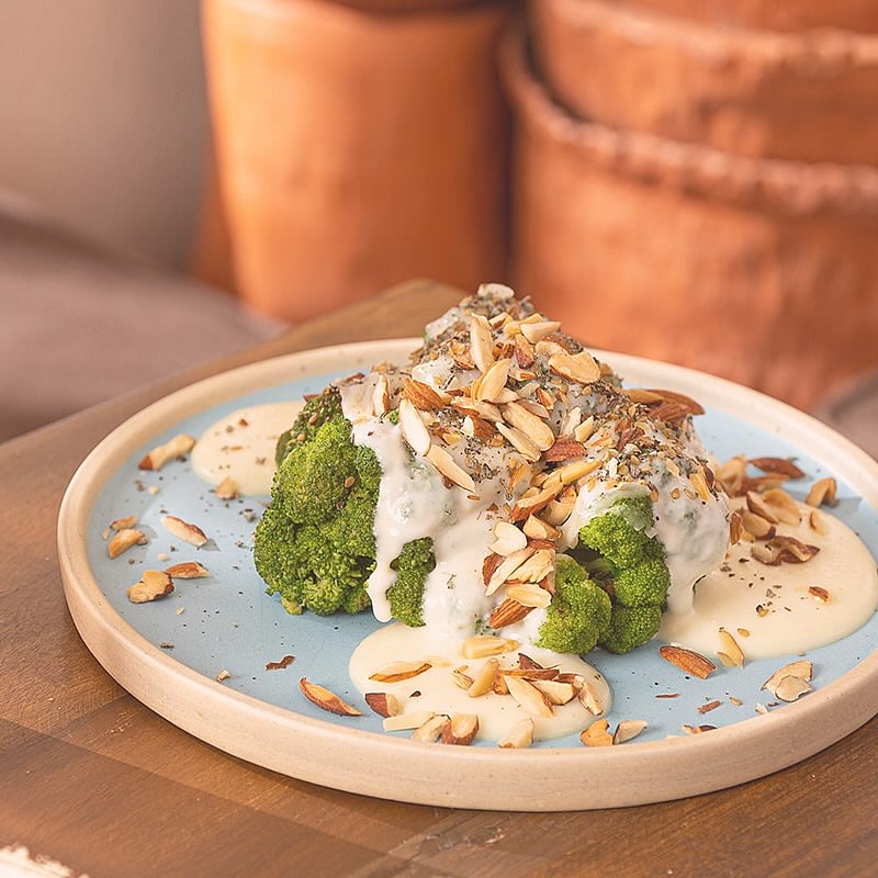 Roasted broccoli with cheese, zaatar, almonds