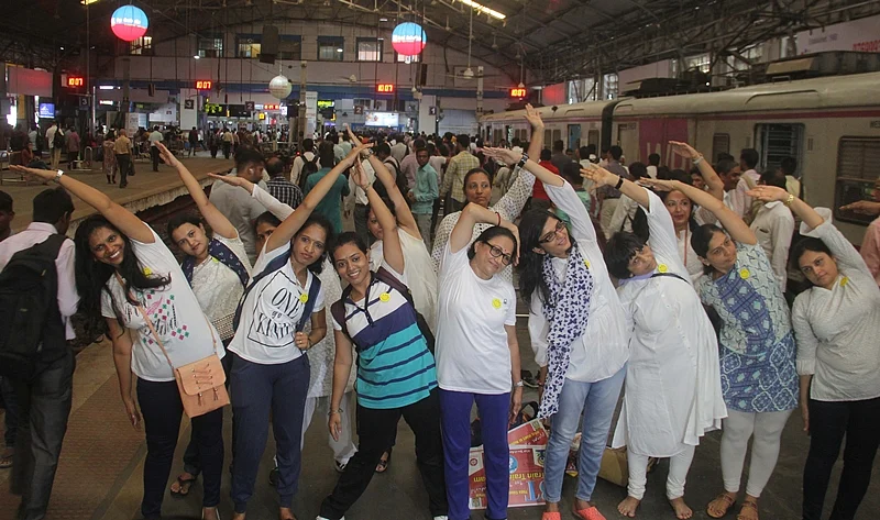 Mumbai: Commuters perform yoga in a suburban local on the occasion of 4th International of Yoga, in Mumbai on Thursday, June 21, 2018. Photo by Bhushan Koyande