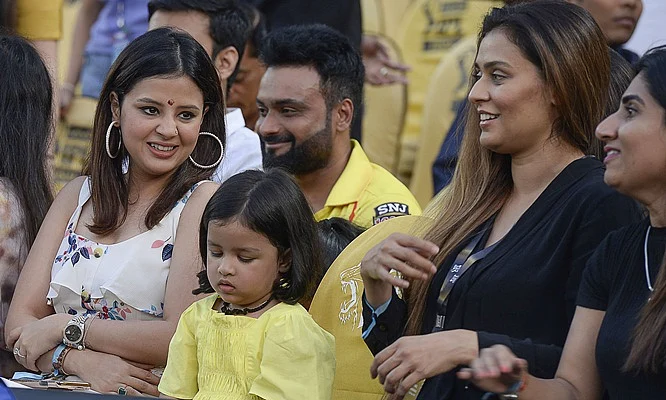 Chennai Super Kings cricket team captain Mahendra Singh Dhoni’s wife Sakshi Dhoni (L) along with her daughter Ziba (C) look on before the start of the 2019 Indian Premier League (IPL) Twenty20 final cricket match between Mumbai Indians and Chennai Super Kings at the Rajiv Gandhi International Cricket Stadium in Hyderabad on May 12, 2019. (Photo by NOAH SEELAM / AFP)