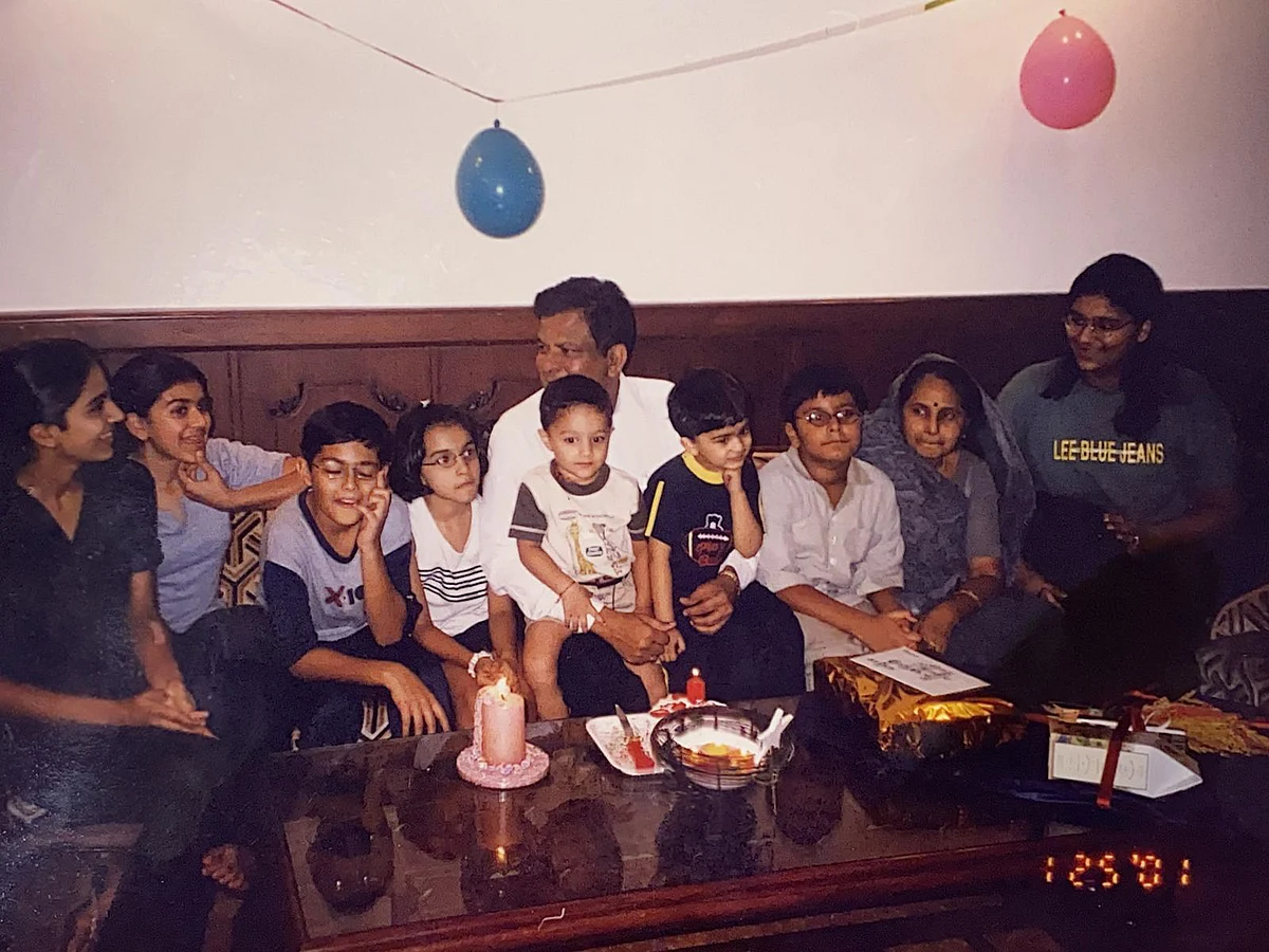 Adi (5th from left) with his family
