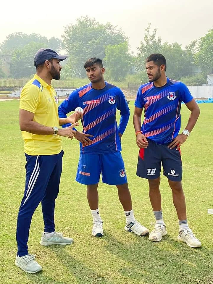 Shadab Jakati (left) guides bowlers in the Uttar Pradesh U-25 team.