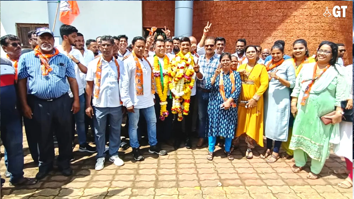 Victorious BJP candidate from Reis Magos Sandeep Bandodkar posing for the photograph with his supporters.