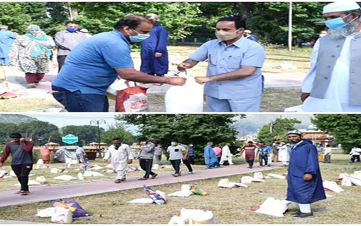 Tourism department distributes food kits at Rajbagh