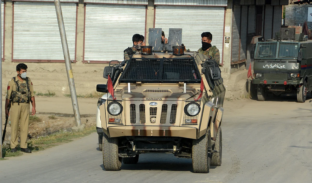 Police and Army personnel leaving the Gunfight site in Srinagar's Danmar area, on Friday 16 June 2021.