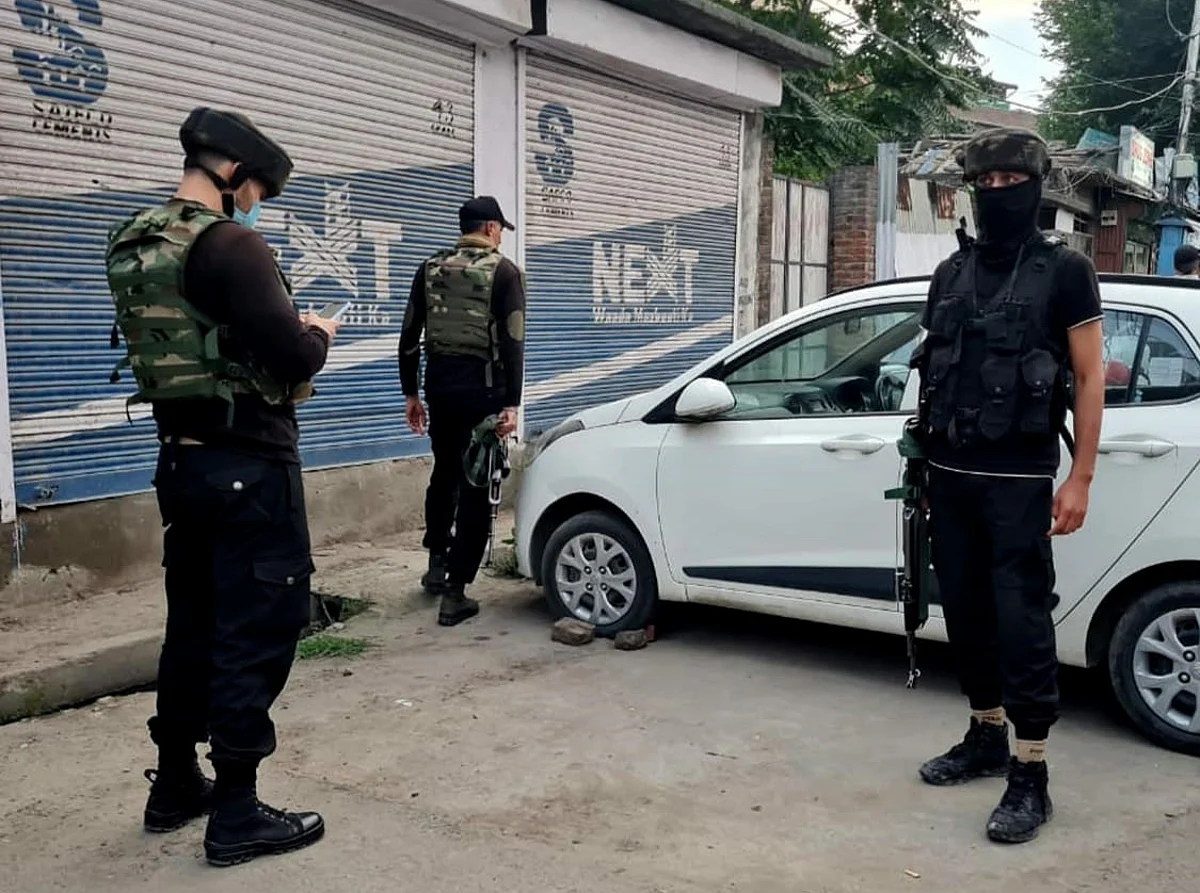 Security forces examine the site of militant attack in Khanyar area of Srinagar on Tuesday August 3, 2021.