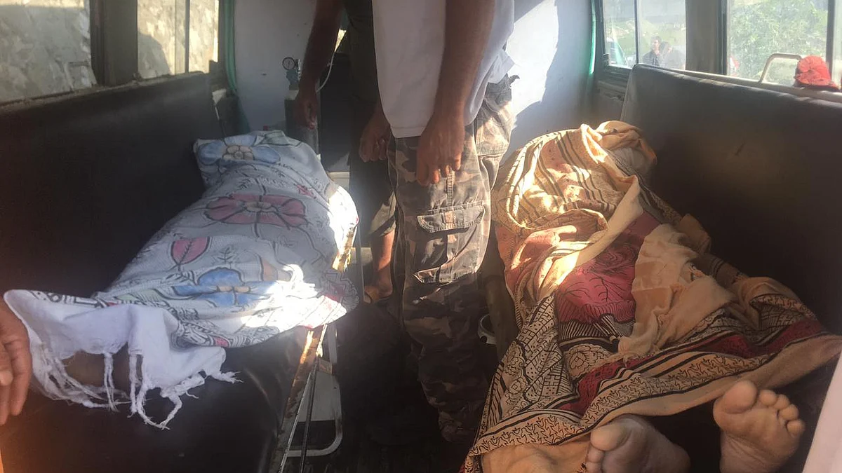 The bodies of Ghulam Rasool Dar and his wife are being shifted to their home.