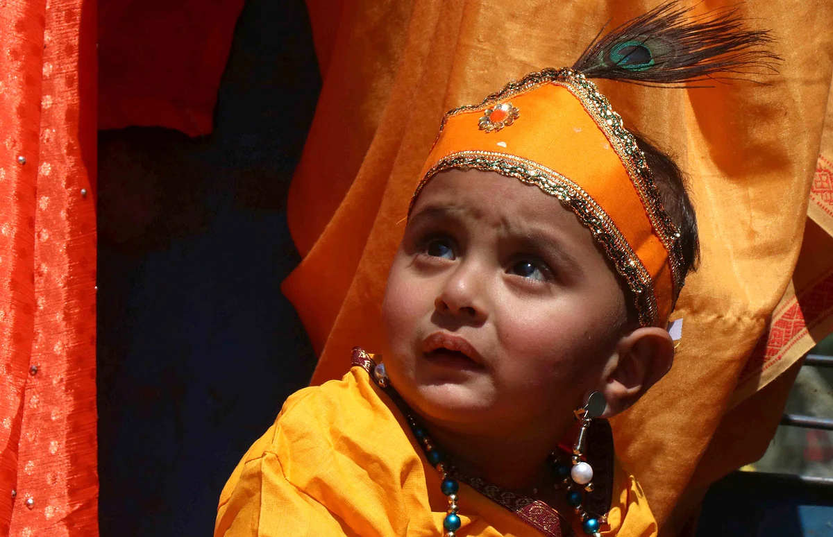 The devotees, including men, women and children, danced alongside the chariot and distributed sweets among people.