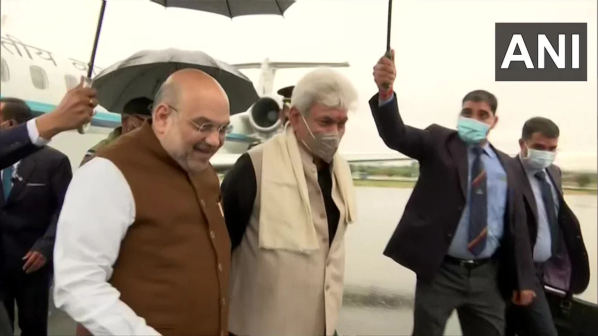 Union Home Minister Amit Shah is welcomed by LG Manoj Sinha at Srinagar airport on Saturday, 23 October 2021.