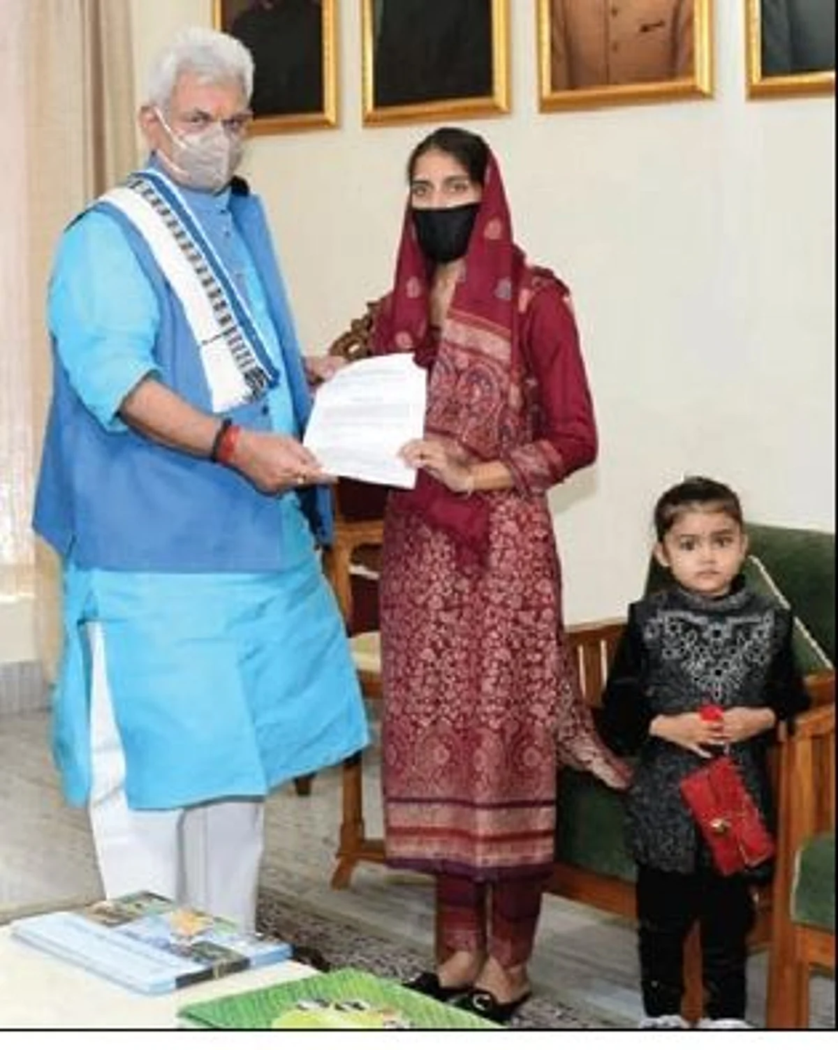 LG hands over appointment letter to wife of slain teacher